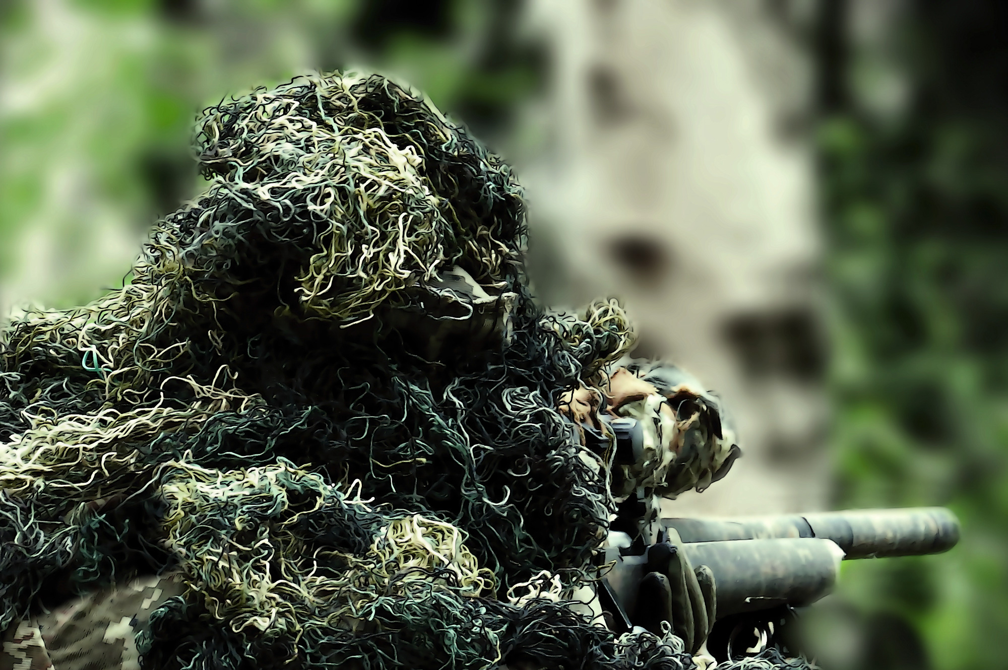 hunter with a ghillie suit