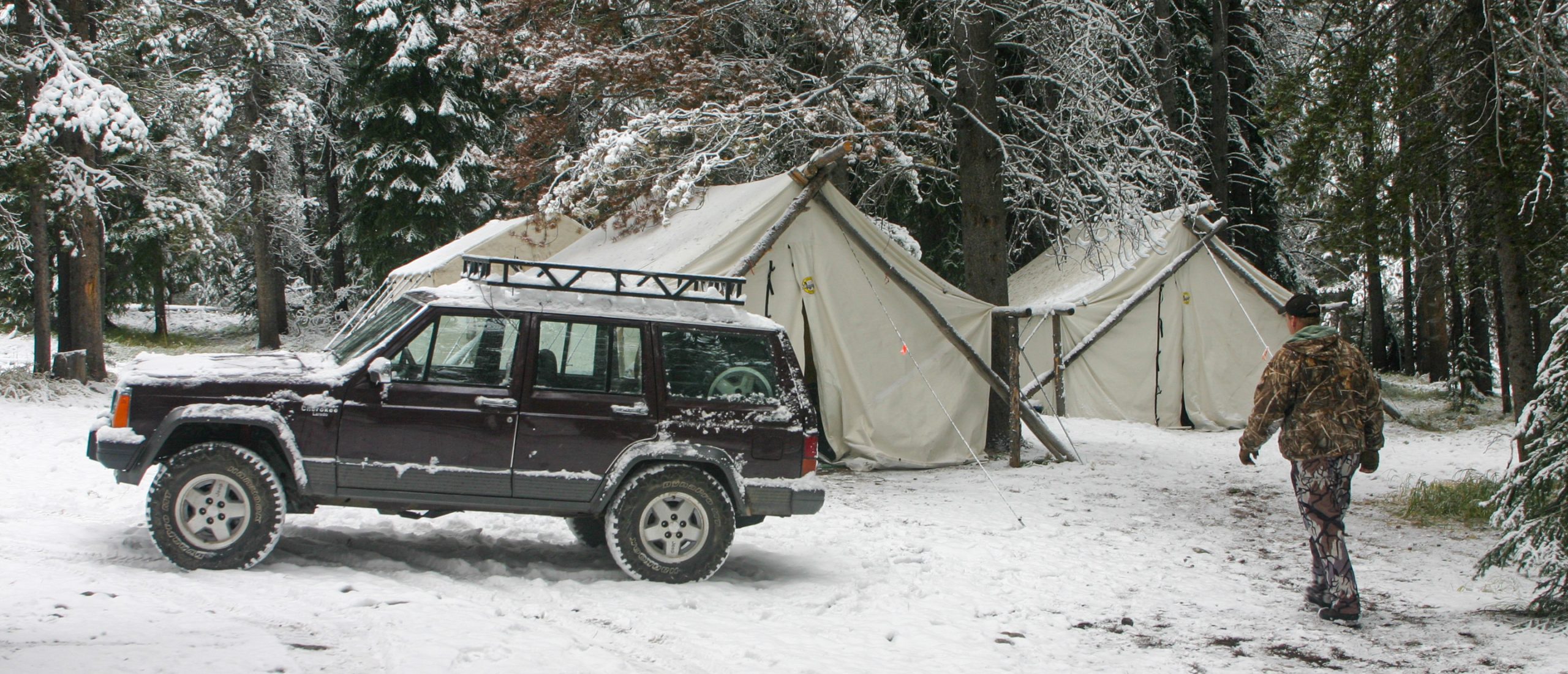 jeep and tents in the snow