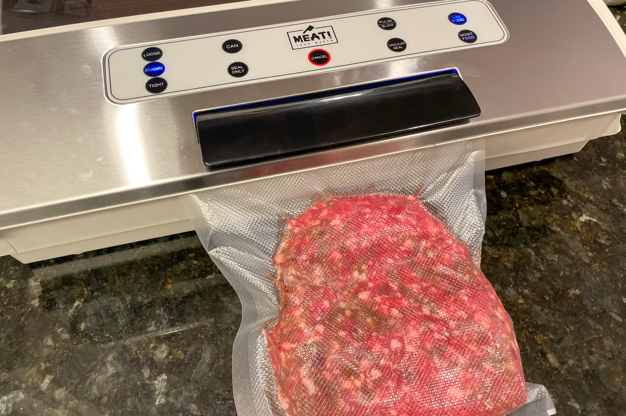 meat! vacuum sealer and a package of venison