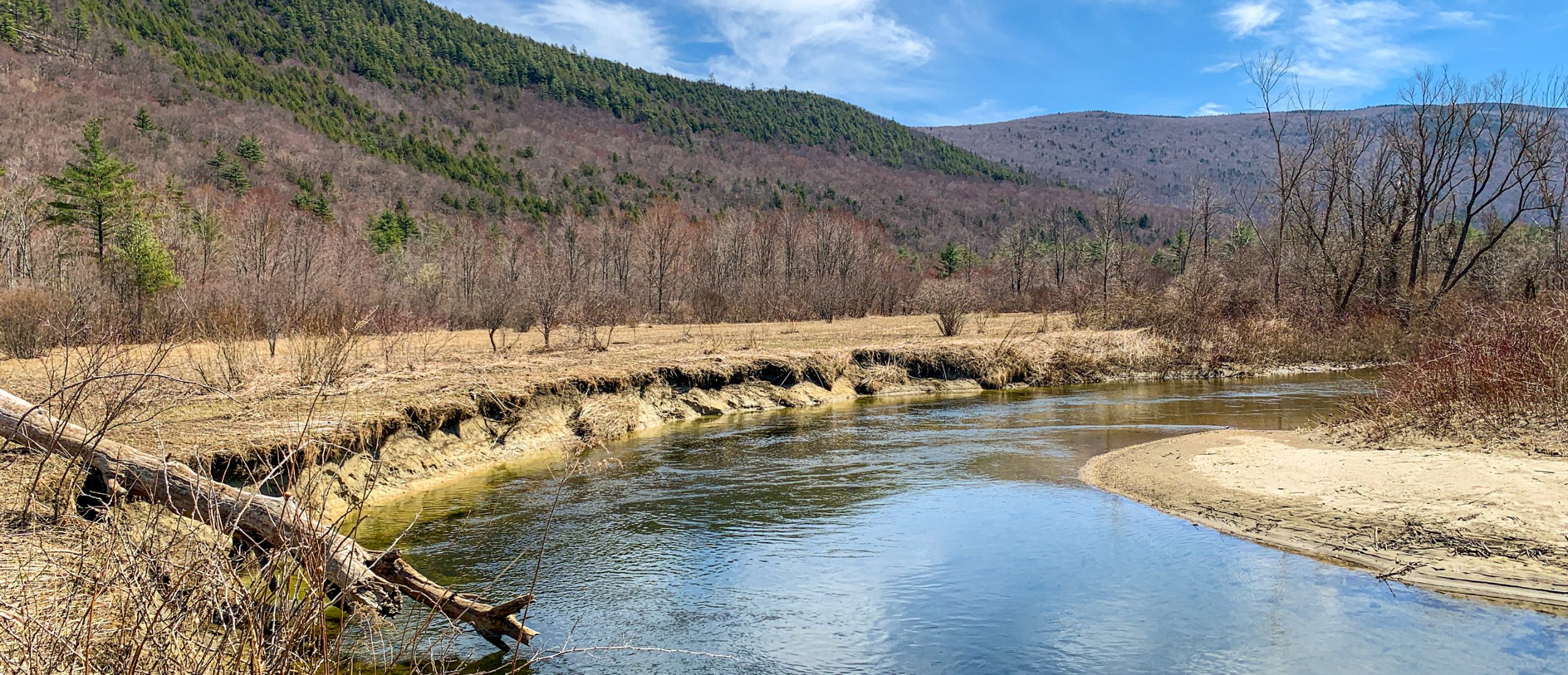 river at the base of a mountain