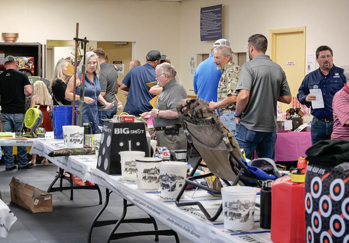 Attendees look at raffle items at the banquet