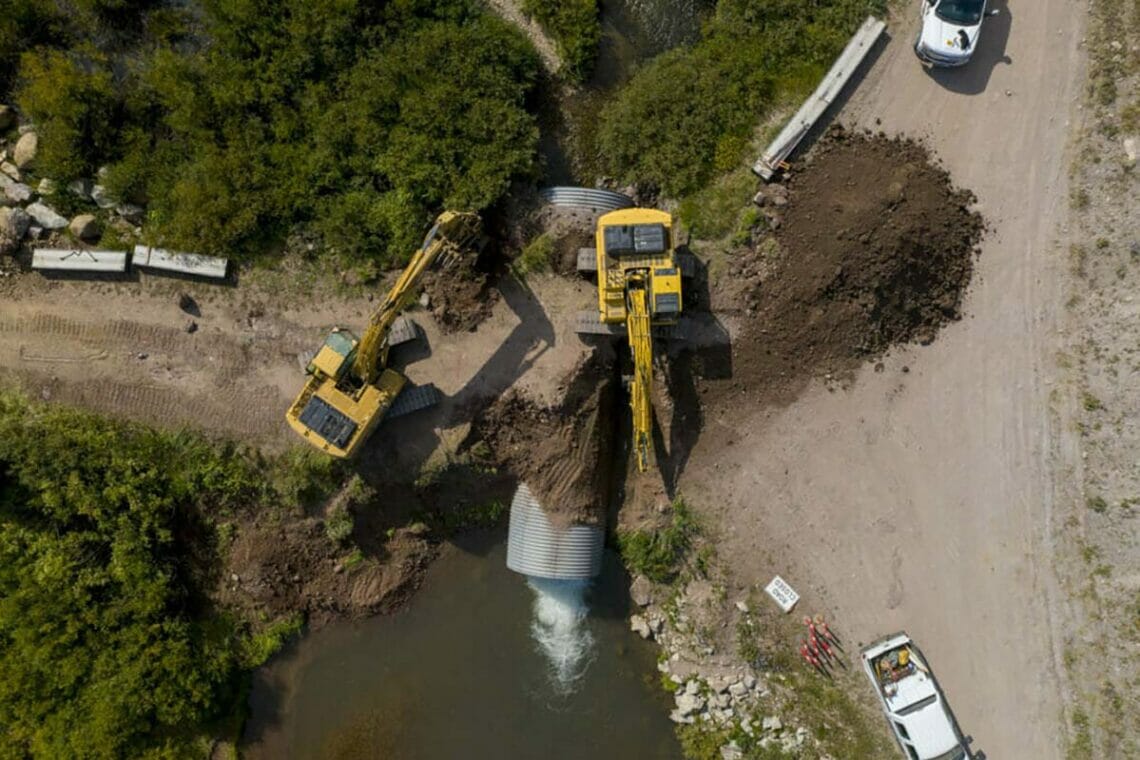 heavy machinery replacing a culvert