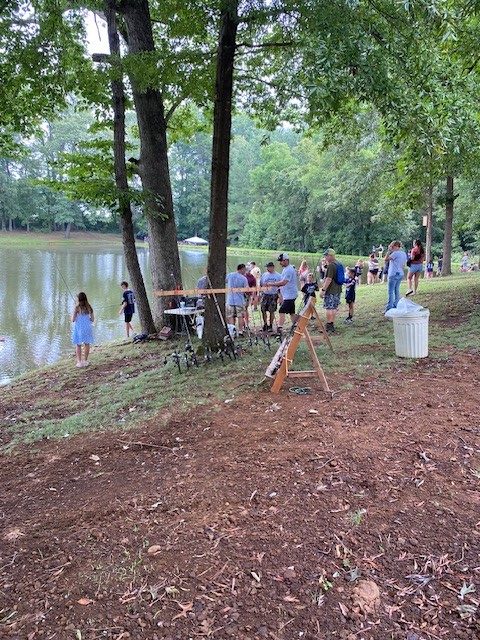 youth at the JAKES day fishing pond-side