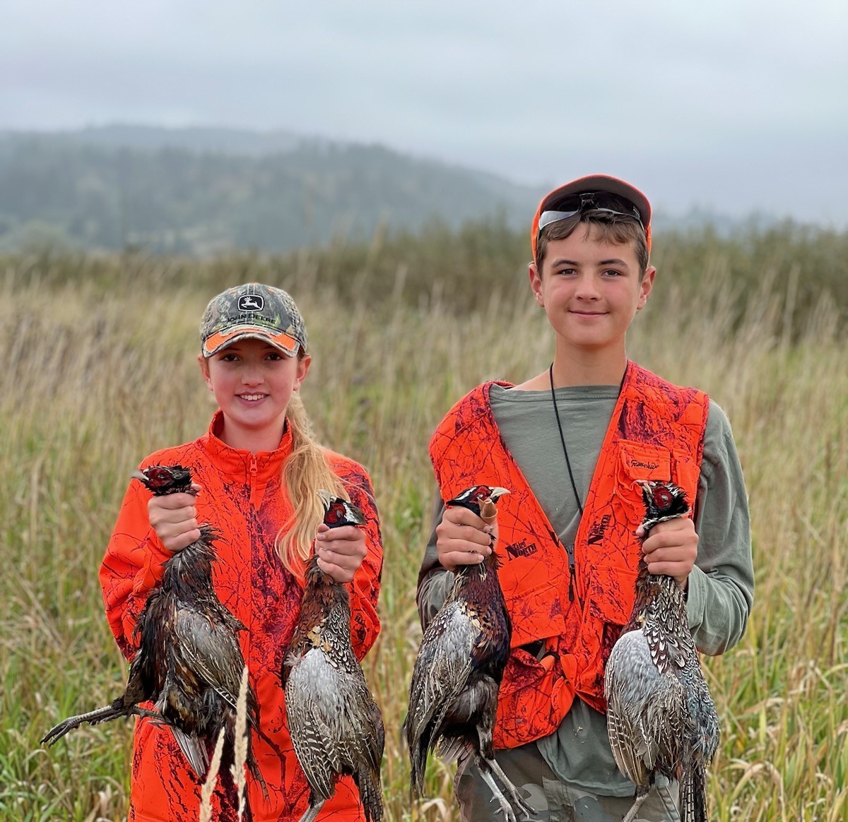 Two Photo credit: John Cooperhunters with harvested pheasants