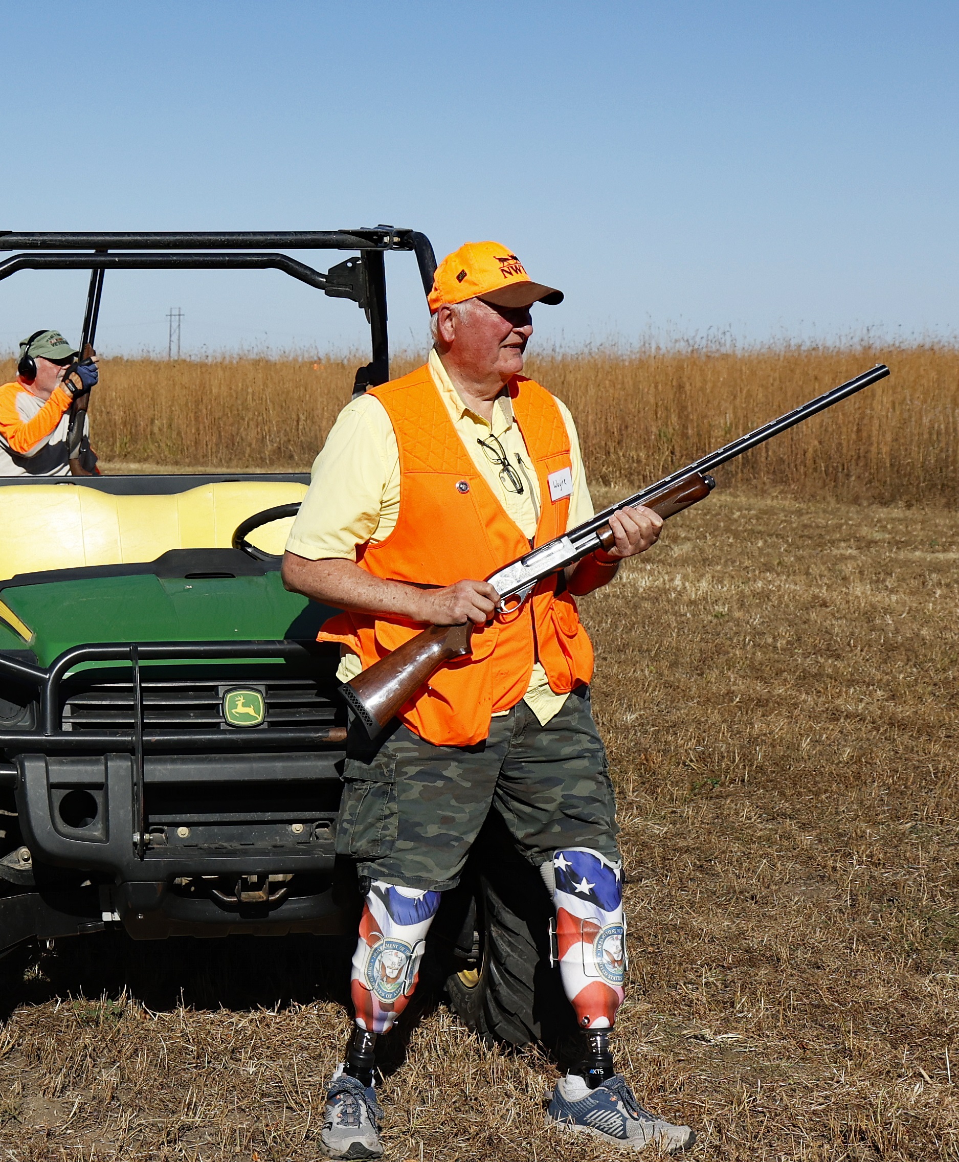 A hunter looks over the praire for pheasants.