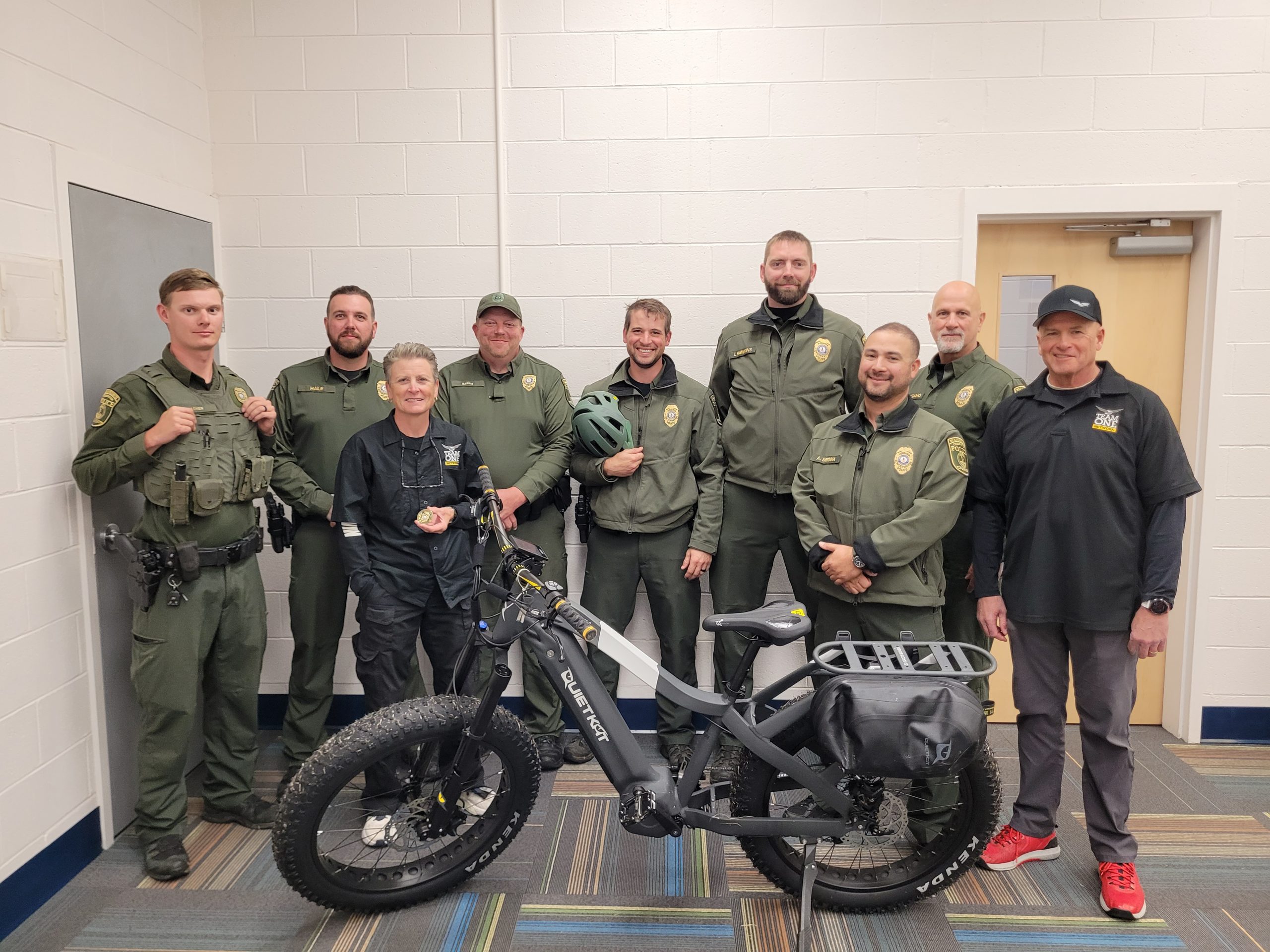 VDWR officers stand behind a QuietKat e-bike