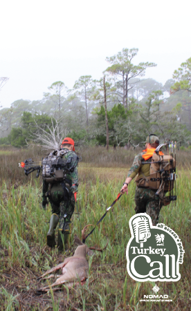 turkey call all access thumb with two hunters dragging a deer