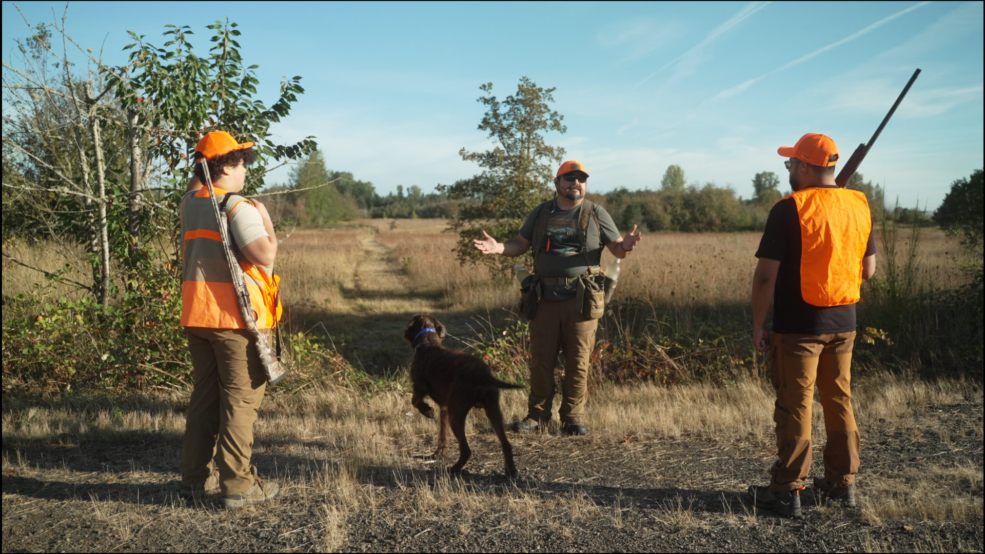 Hunters heading out for a pheasant hunt with a dog